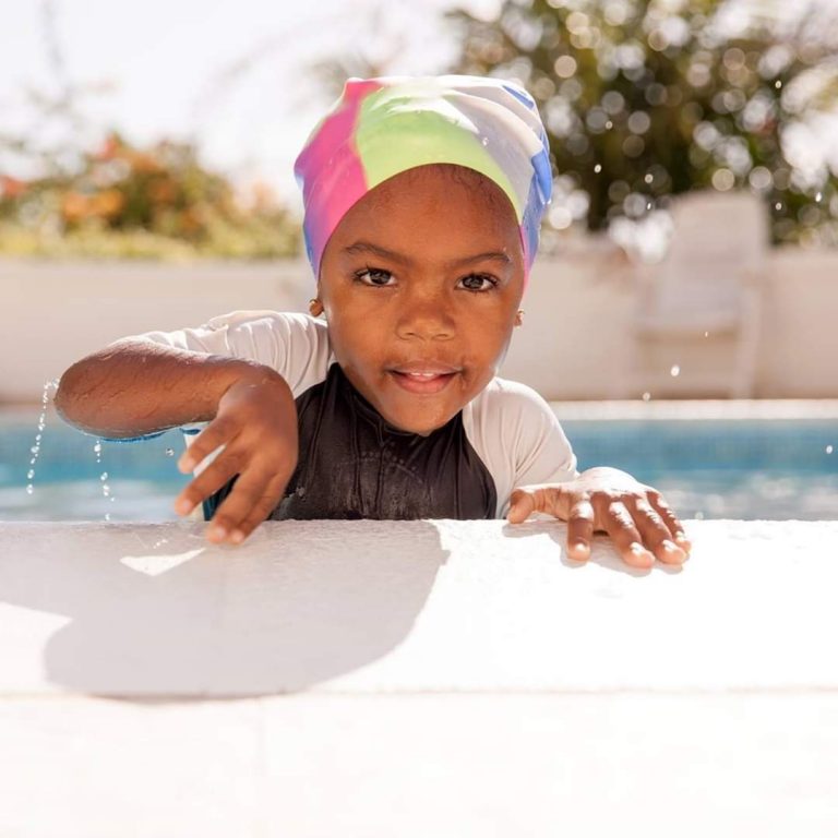 Child Learning To Swim
