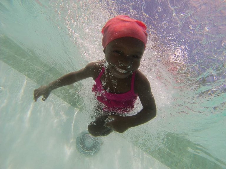 Child Learning To Swim